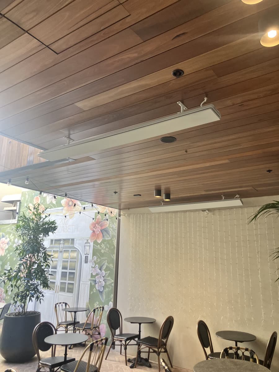 Commercial cafe fit-out with linear pendant lighting