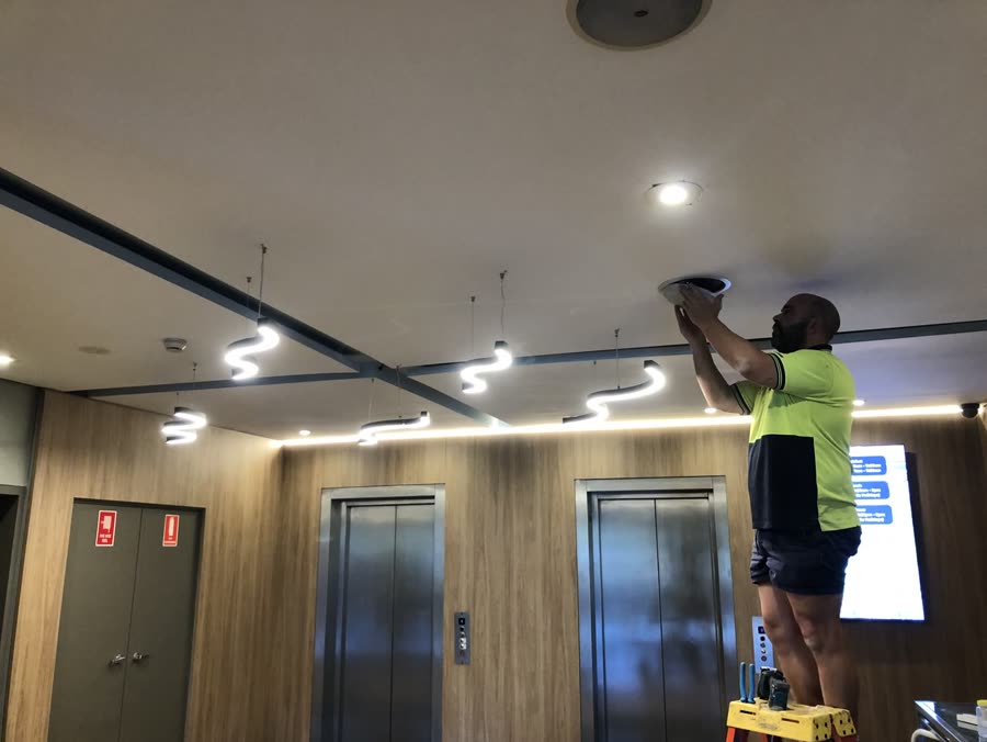 Downlight installation in a commercial building lift lobby